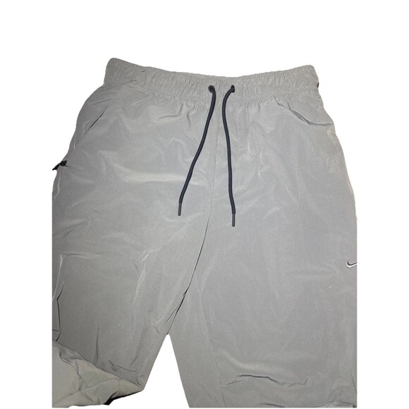 Medium Nike unlimited Men’s Dri-Fit Zip Cuff Versatile Pants Smoke Grey - Picture 3 of 8